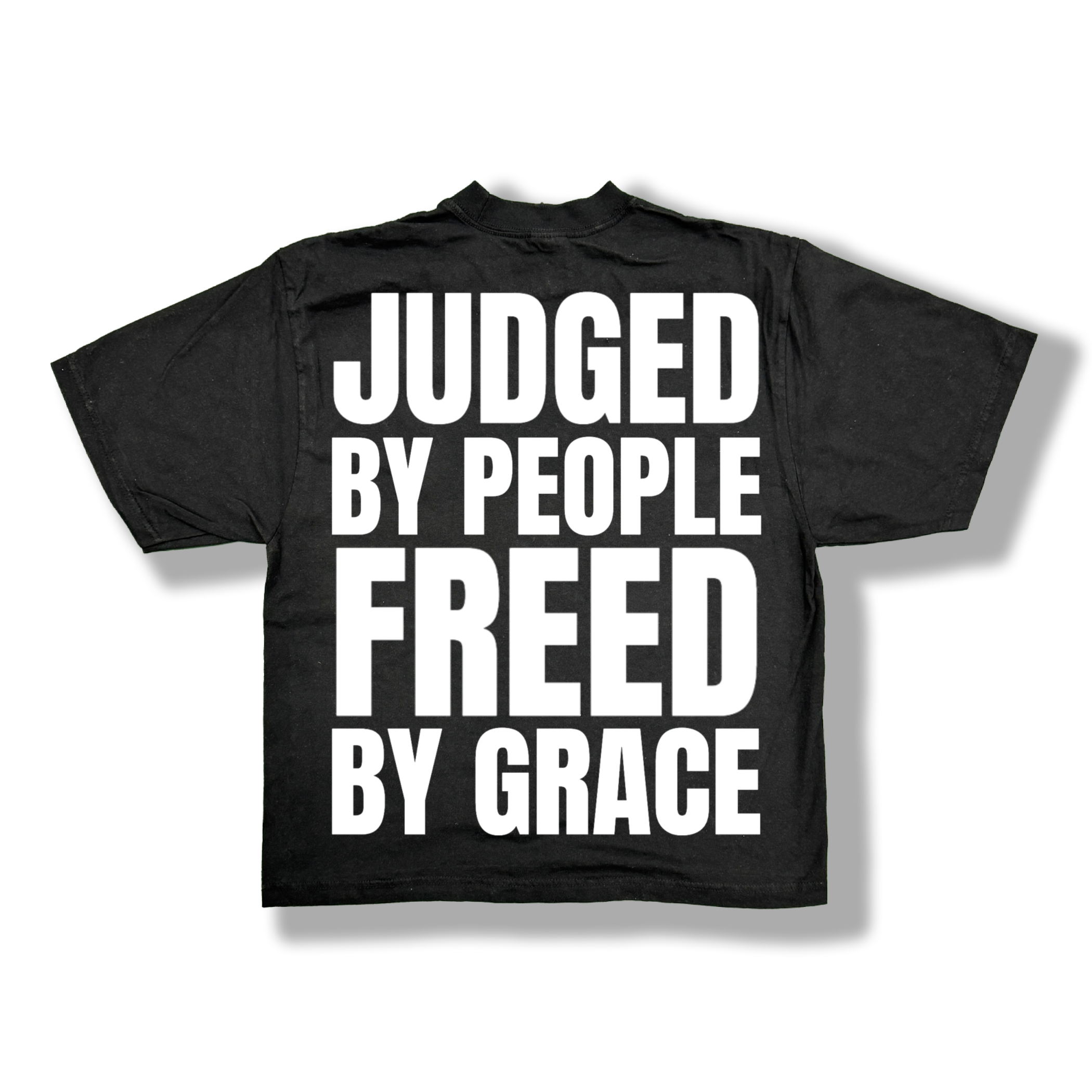 Black t-shirt with white text 'JUDGED BY PEOPLE FREED BY GRACE'